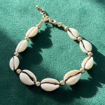 پابند زنانه صدف (طرح کوری) | با مهره‌های طلایی